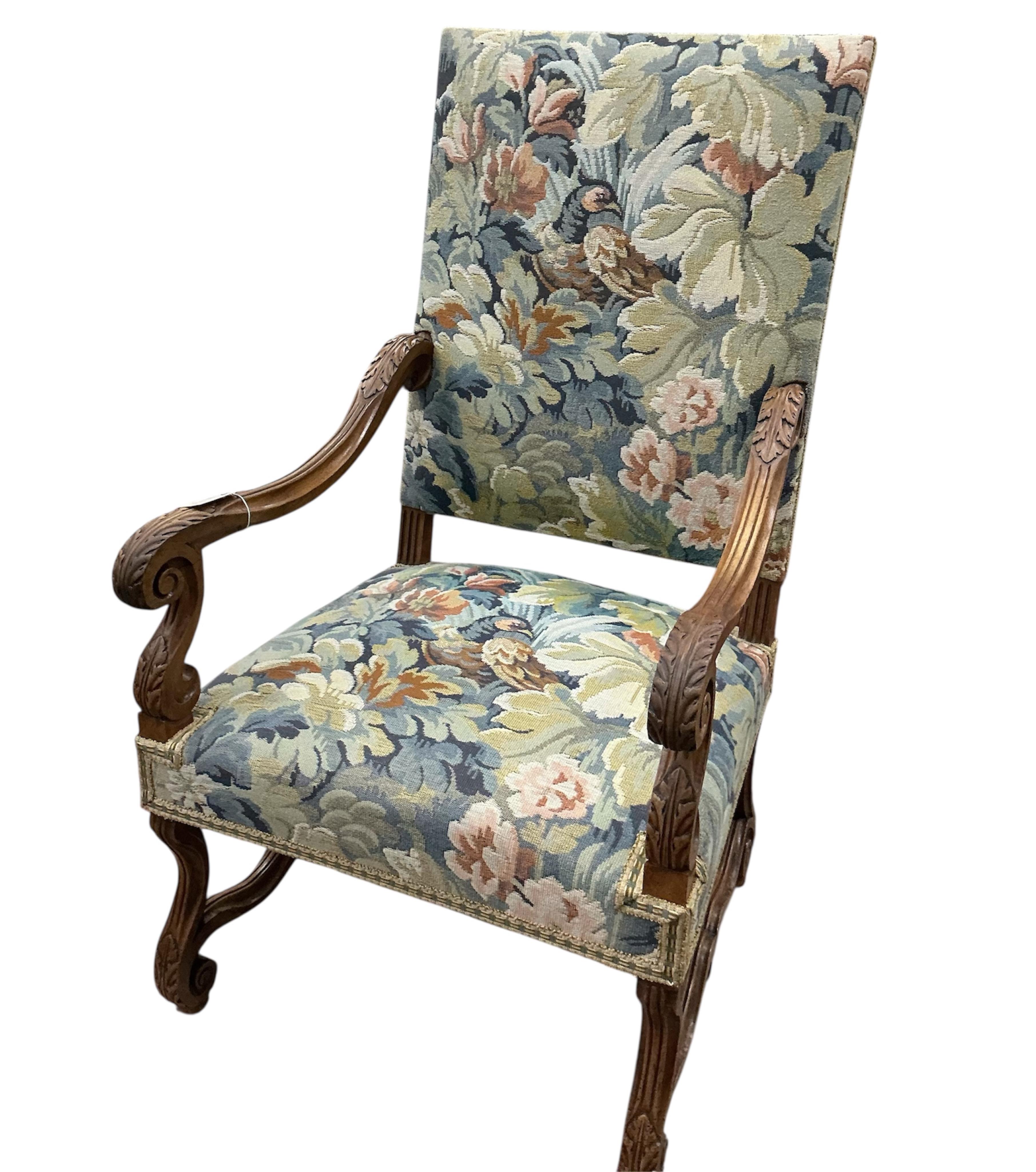 A pair of Louis XIII style walnut armchairs with tapestry upholstery, width 63cm, depth 63cm, height 115cm
